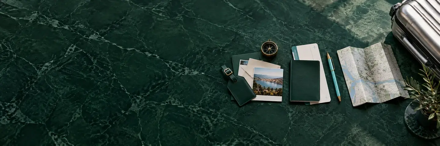 Passport, travel documents and destination map on an emerald planning desk